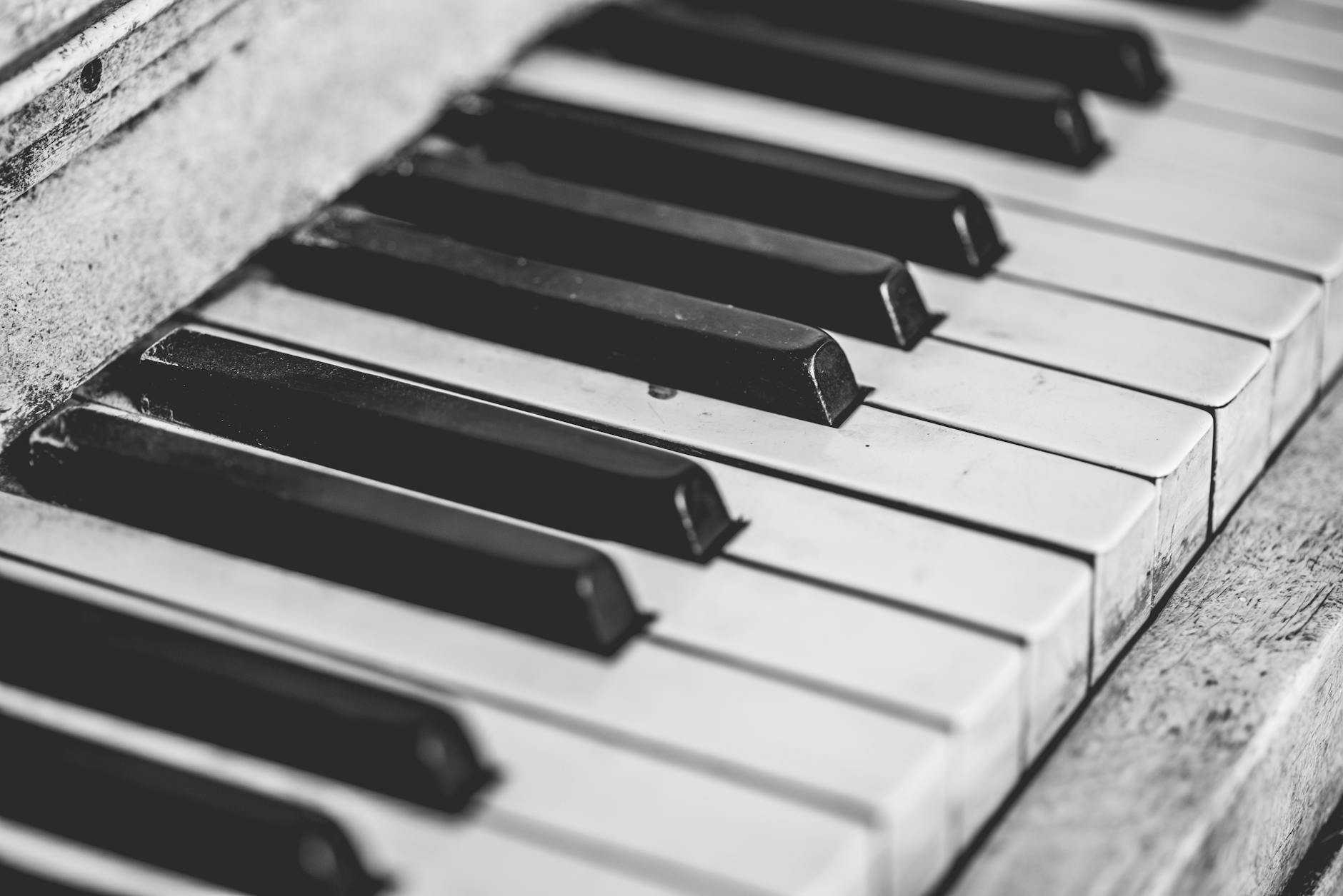 selective focus photography of upright piano